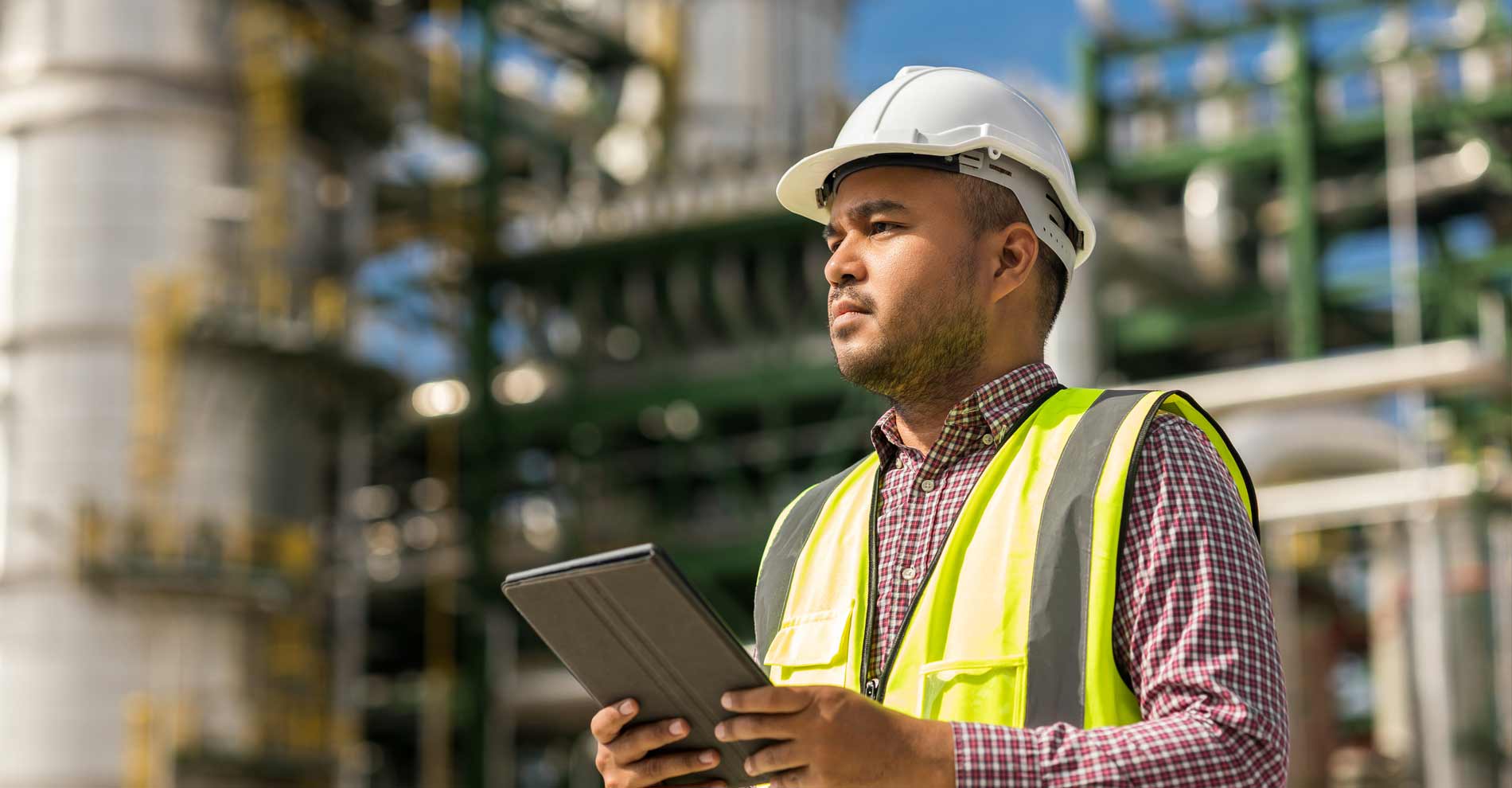 man with tablet using EHS management app
