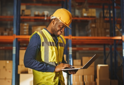 Warehouse-worker-using-laptop