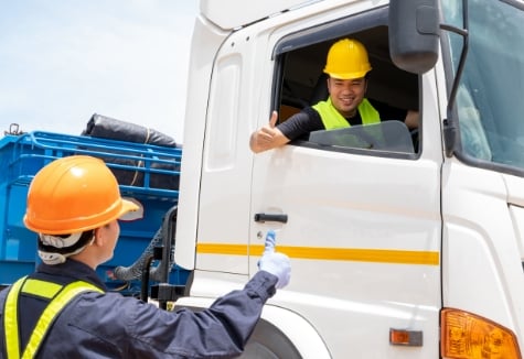 truck-driver-shaking-waving-at-worker